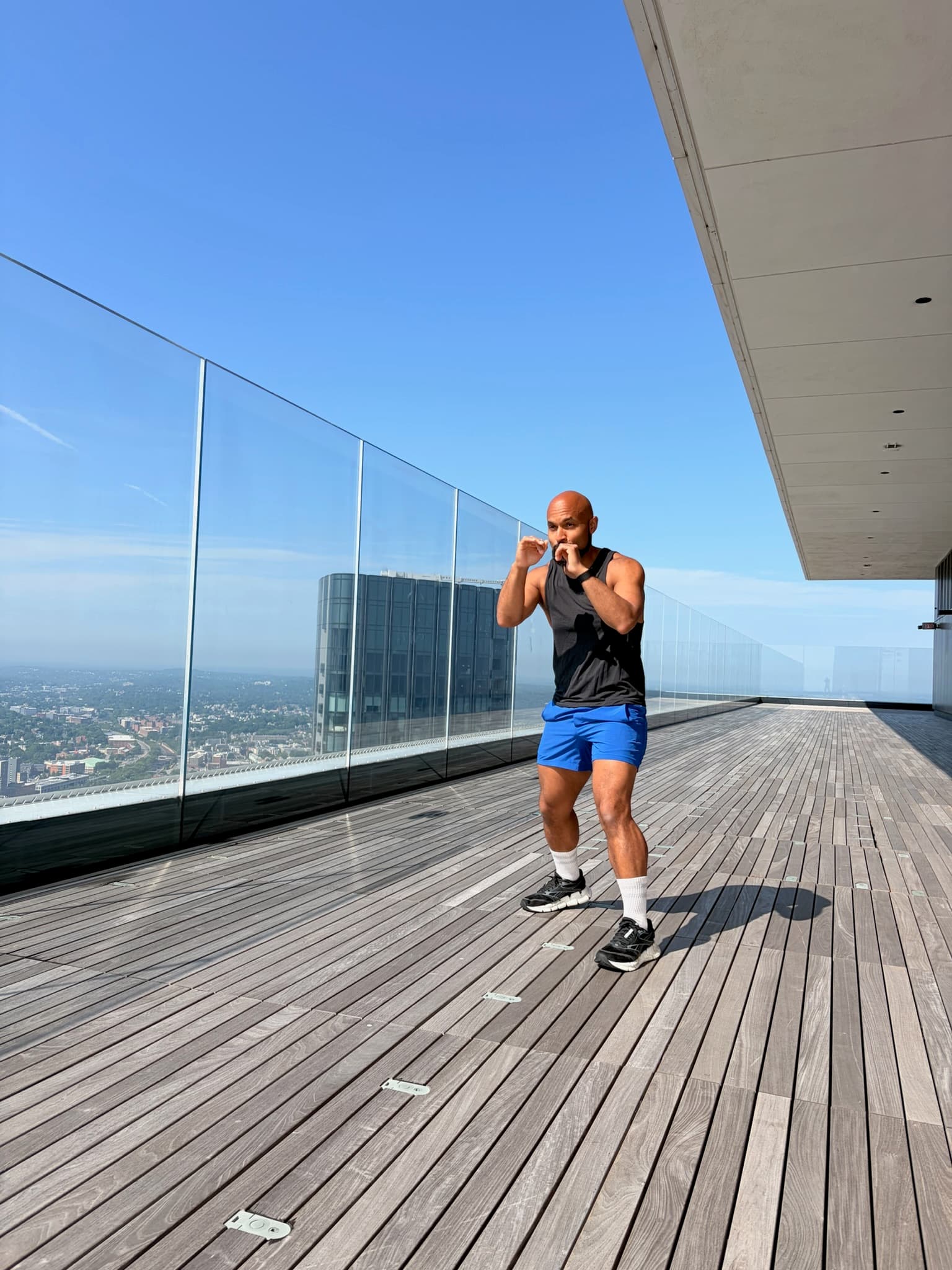 Adrian Bispham, fitness instructor co-leading the Rooftop Wellness Series with Fit Scene Boston and View Boston