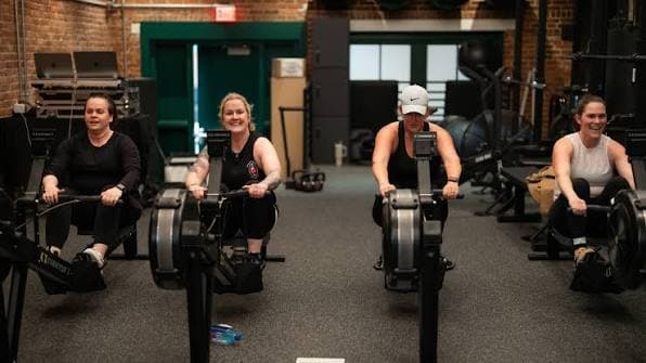 Athletes training for HYROX Boston 2026 — functional fitness stations and running at Backyard Boston ahead of the October race at the Boston Convention & Exhibition Center.