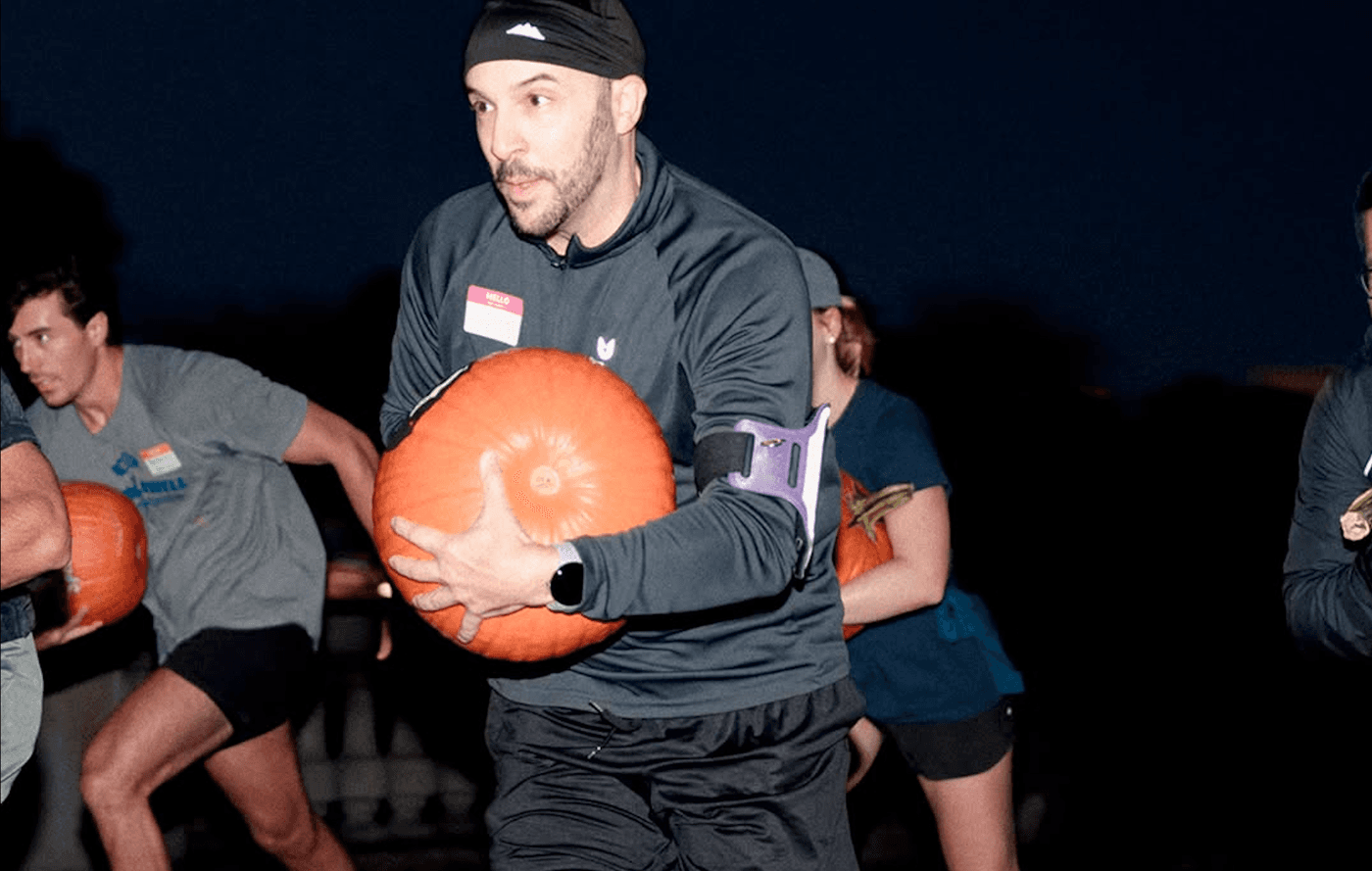 Pumpkin Relay at Marathon Sports Boston, a Halloween-themed running event where teams race while carrying pumpkins.