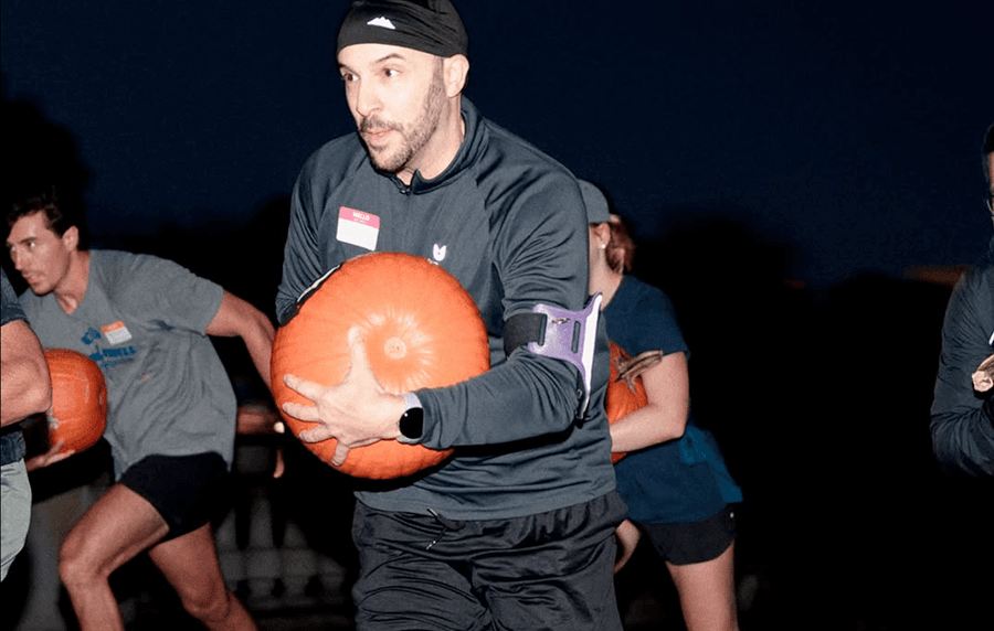 Pumpkin Relay at Marathon Sports Boston, a Halloween-themed running event where teams race while carrying pumpkins.